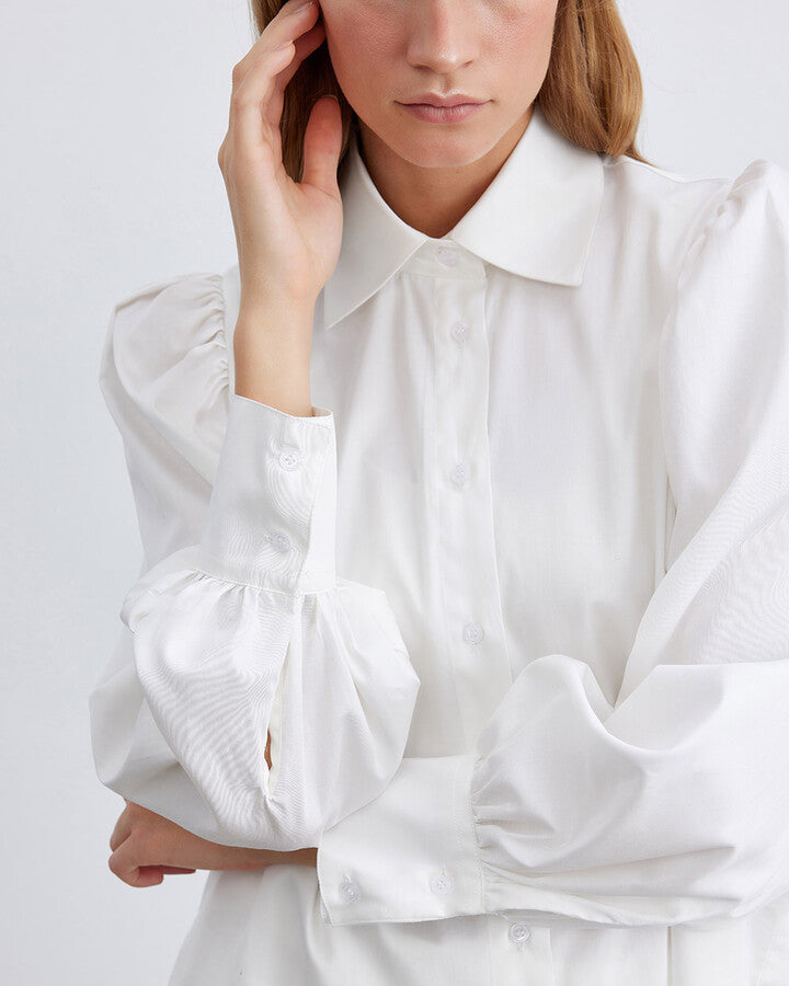 Elevate your wardrobe with the Ecru Cotton Satin Shoulder Gathered Chic Shirt. Combining luxurious satin with breathable cotton, this sophisticated ecru shirt suits any occasion, from casual outings to elegant evenings. The unique shoulder gathered design adds modern flair, ensuring you stand out in style. Perfectly tailored for a flattering fit, this chic shirt is a must-have for fashion enthusiasts seeking timeless elegance and contemporary appeal.